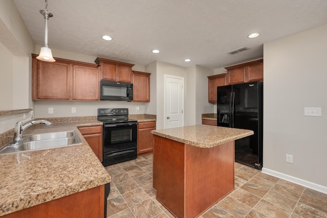 kitchen with light tile floors, a kitchen island, black appliances, and sink