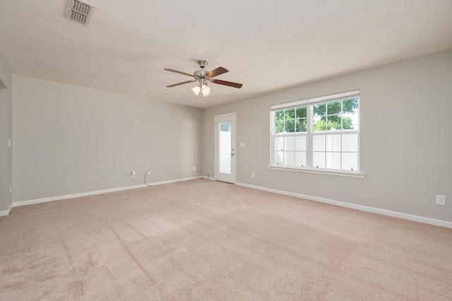 unfurnished room with ceiling fan and light colored carpet