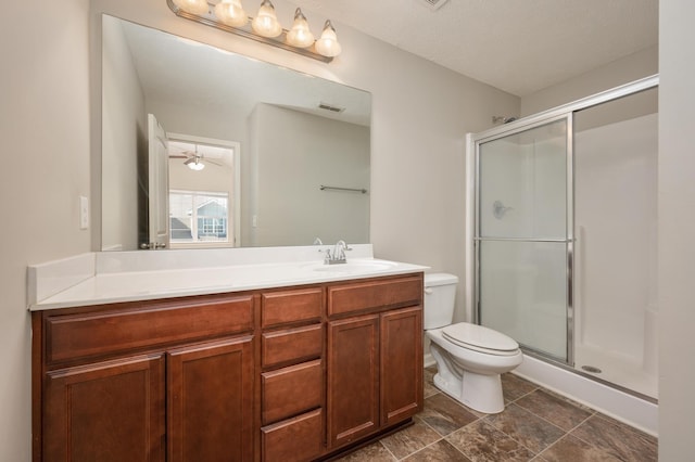 bathroom with toilet, ceiling fan, an enclosed shower, tile floors, and vanity