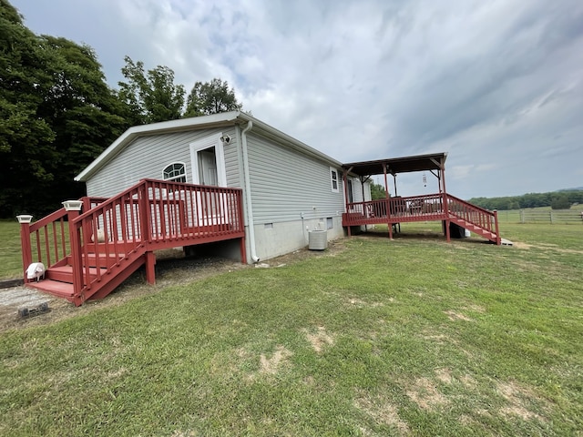 72 Golden Hollow Rd, Kelso, TN 37348 - back of house featuring a wooden deck, central AC, and a yard