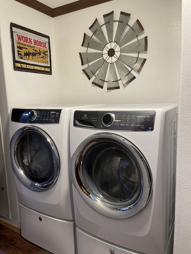72 Golden Hollow Rd, Kelso, TN 37348 - clothes washing area with ornamental molding, dark hardwood / wood-style floors, and washer and clothes dryer