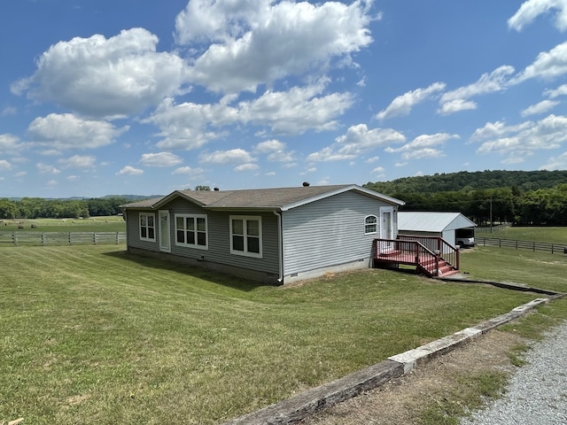 72 Golden Hollow Rd, Kelso, TN 37348 - view of front of home featuring a rural view, a front yard, and a deck