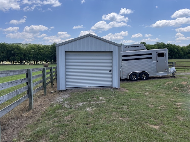 72 Golden Hollow Rd, Kelso, TN 37348 - garage featuring a lawn and a rural view