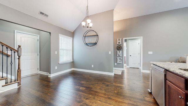 interior space with dark hardwood / wood-style flooring, a chandelier, and vaulted ceiling