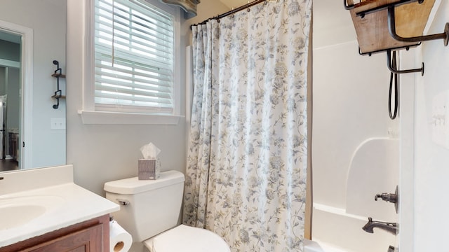 full bathroom featuring toilet, shower / bath combo, and vanity