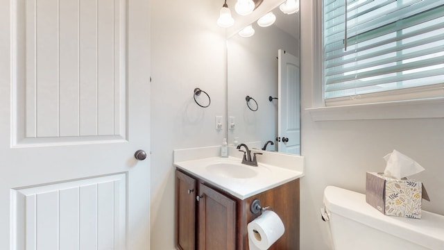 bathroom featuring toilet and vanity