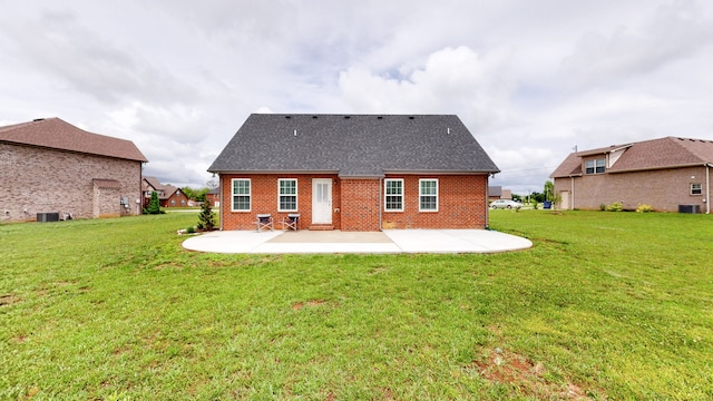 rear view of house with a patio area and a yard