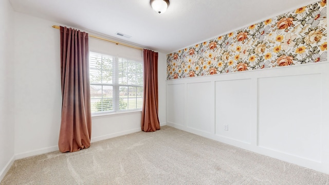 empty room with light colored carpet