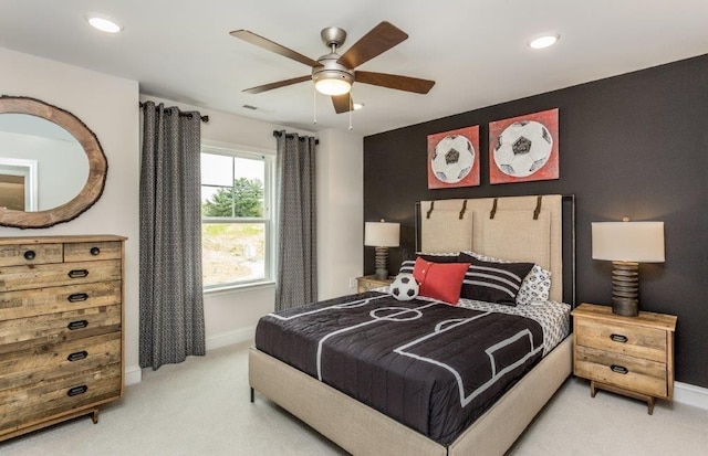 carpeted bedroom with ceiling fan