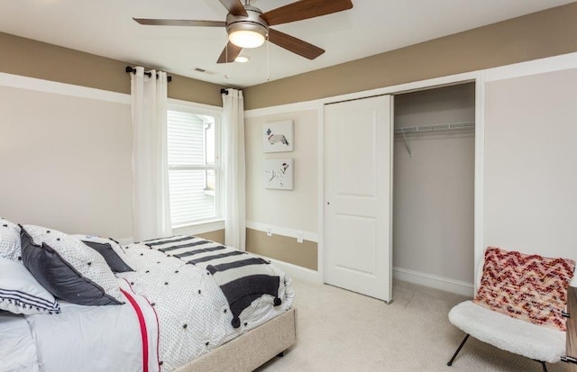 carpeted bedroom with a closet and ceiling fan