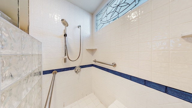 bathroom with tiled shower