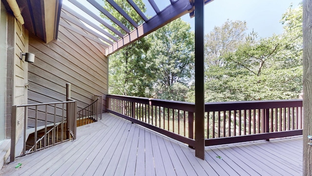 wooden deck featuring a pergola