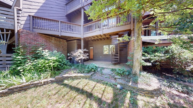 rear view of property with a patio area