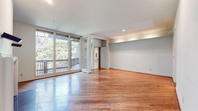 spare room with light hardwood / wood-style floors