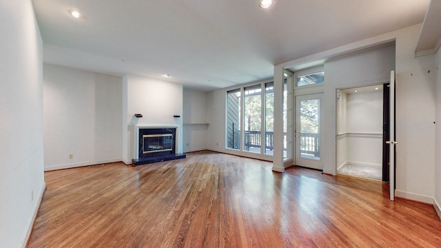 unfurnished living room featuring light wood-type flooring