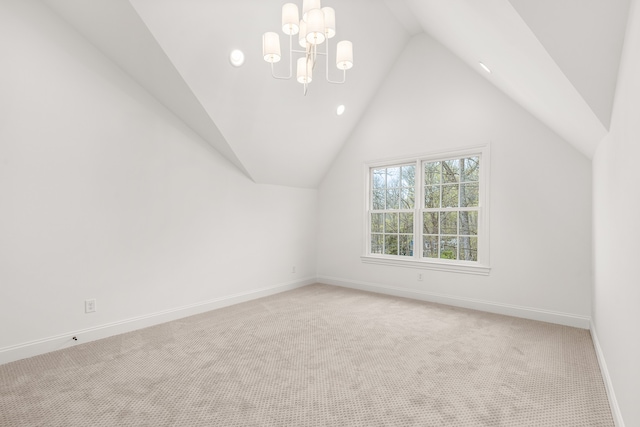 additional living space with light carpet, lofted ceiling, and an inviting chandelier