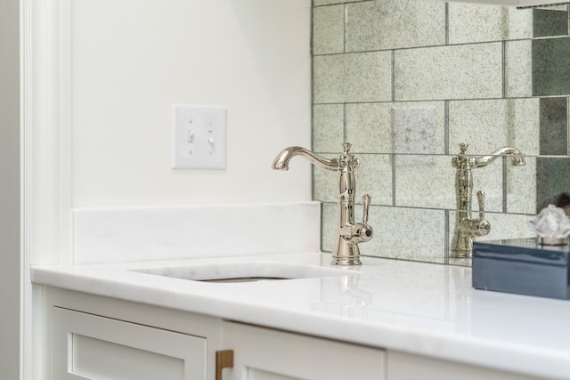 bathroom featuring a bath to relax in and sink