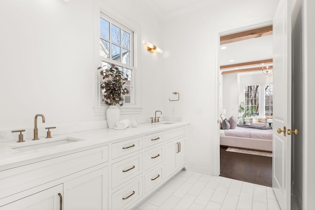 bathroom with beam ceiling, double sink vanity, tile flooring, and a wealth of natural light