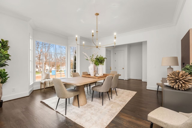 dining room with a chandelier, ornamental molding, and dark hardwood / wood-style flooring