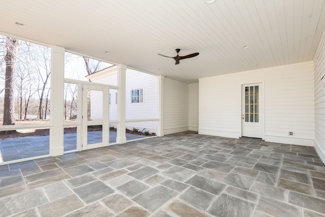 interior space featuring ceiling fan