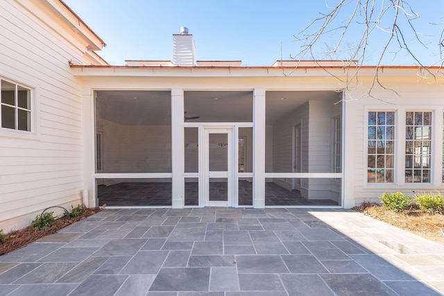 entrance to property featuring a patio area