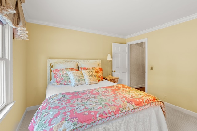 carpeted bedroom featuring ornamental molding