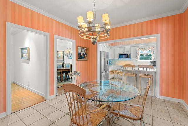 tiled dining room featuring ornamental molding and a notable chandelier