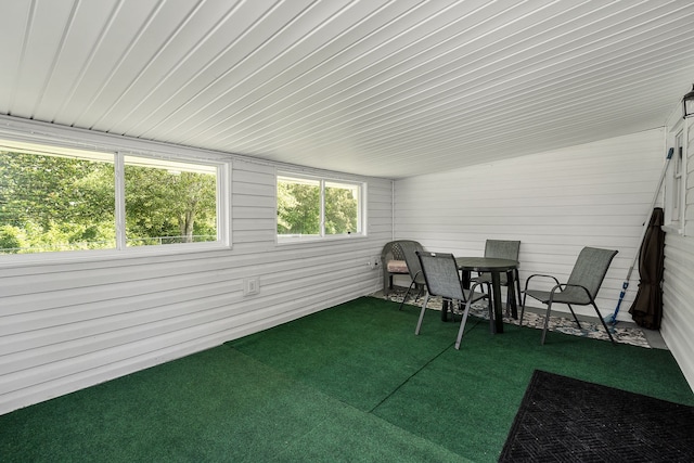 sunroom featuring lofted ceiling