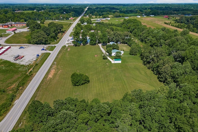 birds eye view of property with a rural view