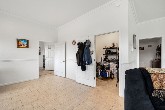 hallway with light tile flooring and ornamental molding