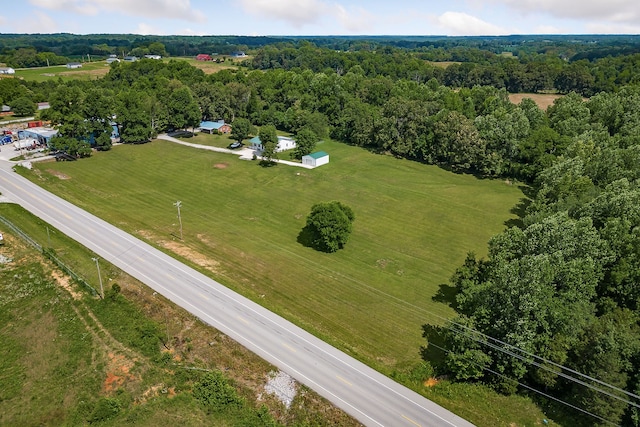 birds eye view of property with a rural view