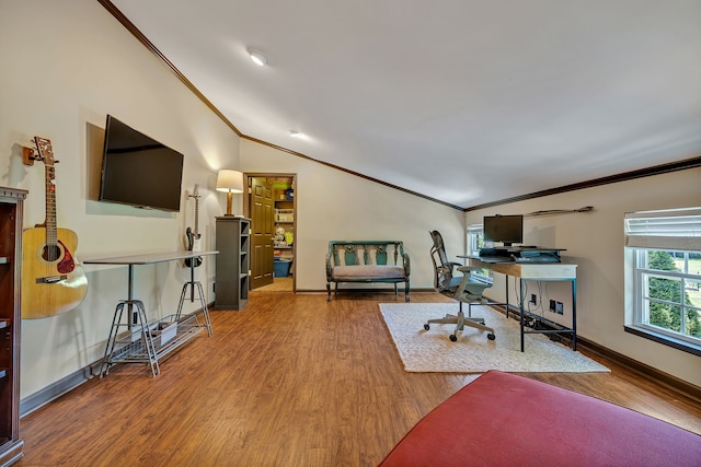 office space with crown molding, vaulted ceiling, and hardwood / wood-style flooring