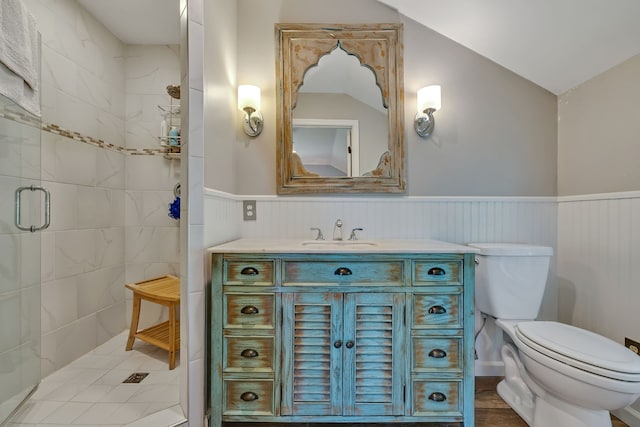 bathroom with an enclosed shower, vanity, vaulted ceiling, toilet, and hardwood / wood-style flooring