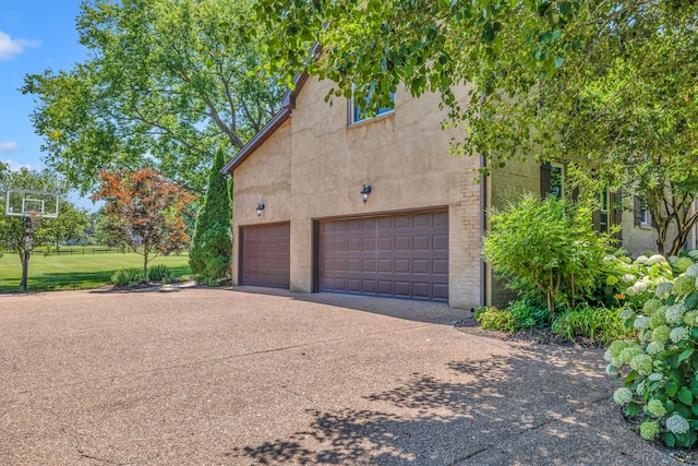 garage with a yard