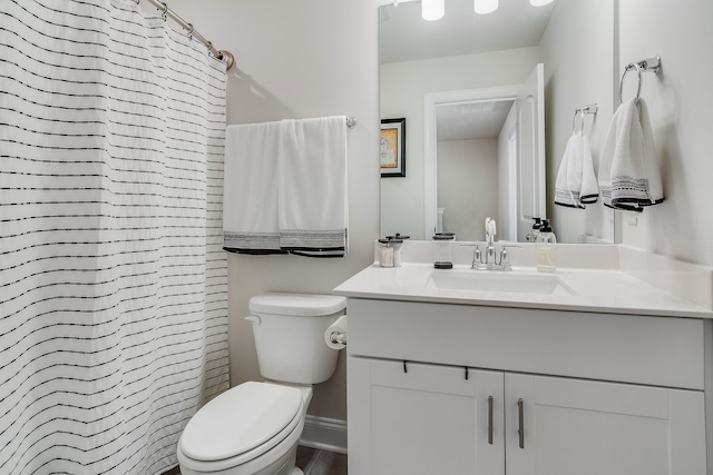 bathroom with toilet and vanity