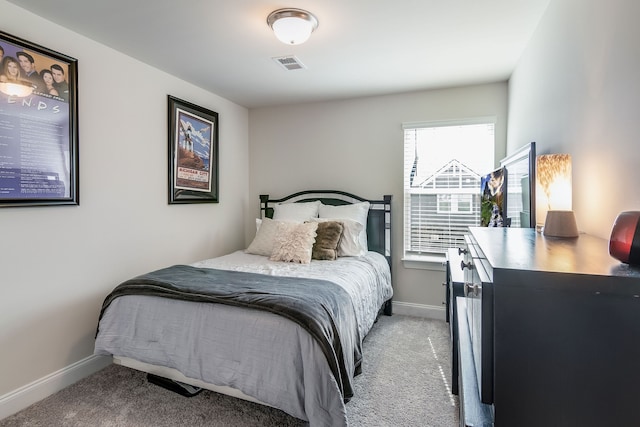 bedroom with light carpet