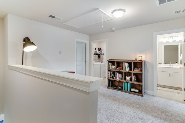 interior space with light colored carpet and separate washer and dryer