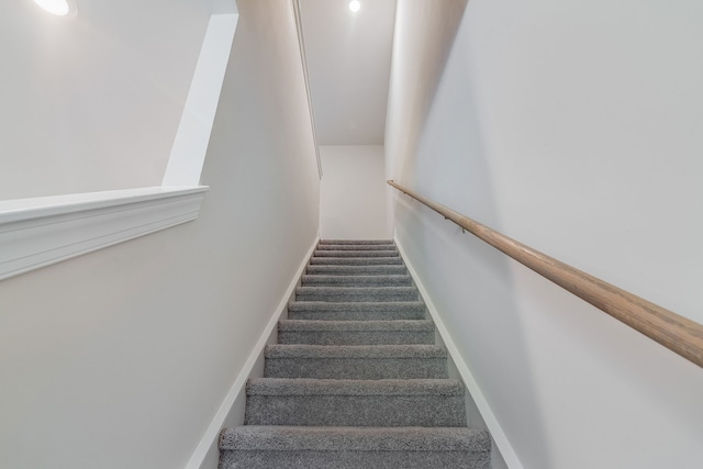 stairway with carpet floors