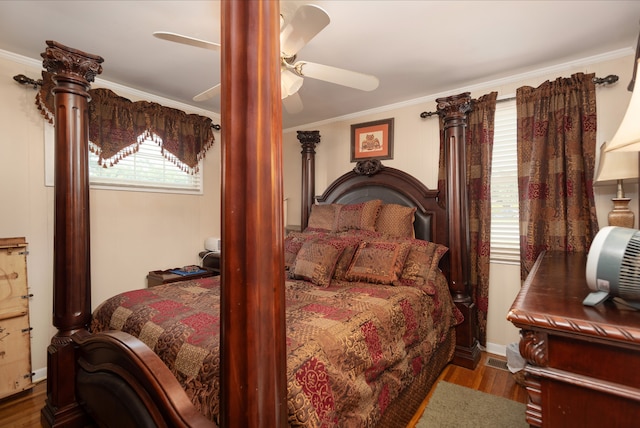 bedroom featuring ceiling fan, ornamental molding, and dark wood-type flooring