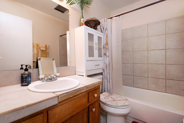 full bathroom with tile floors, shower / tub combo with curtain, vanity with extensive cabinet space, and toilet