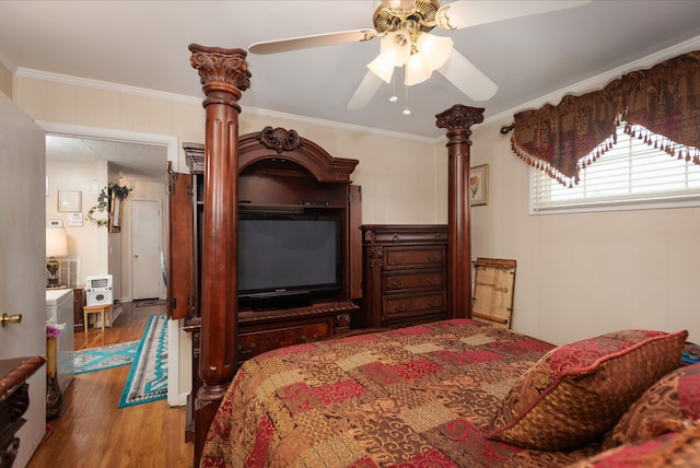 bedroom with ornamental molding, ceiling fan, and hardwood / wood-style flooring