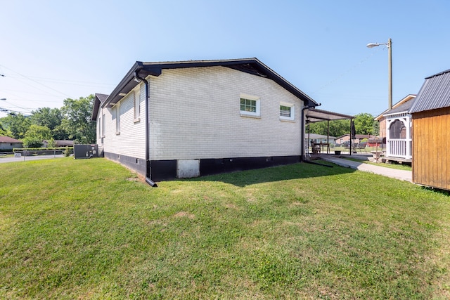 rear view of house featuring a yard