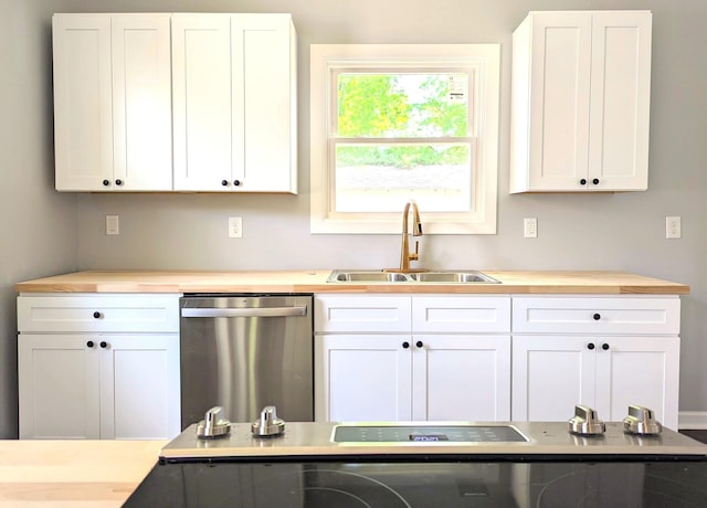 kitchen featuring white cabinets and dishwasher