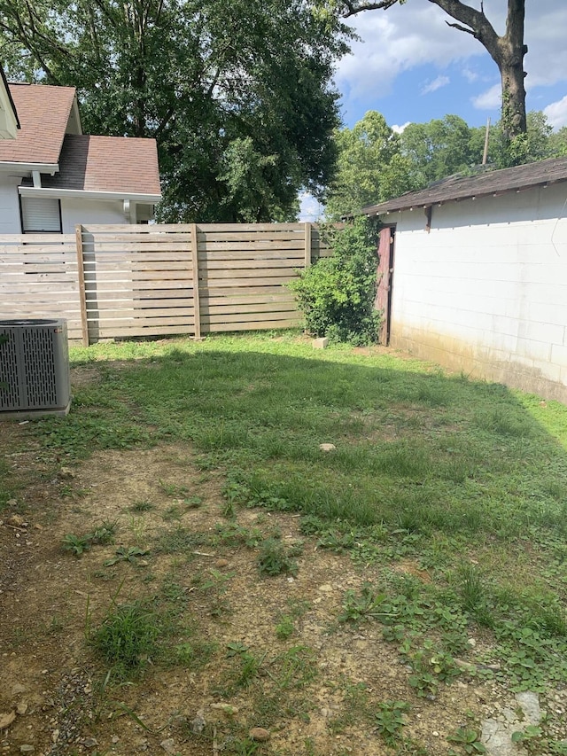 view of yard with central air condition unit