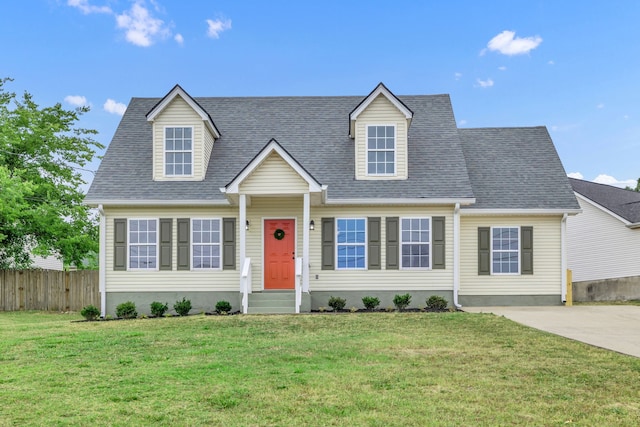 cape cod-style house with a front lawn