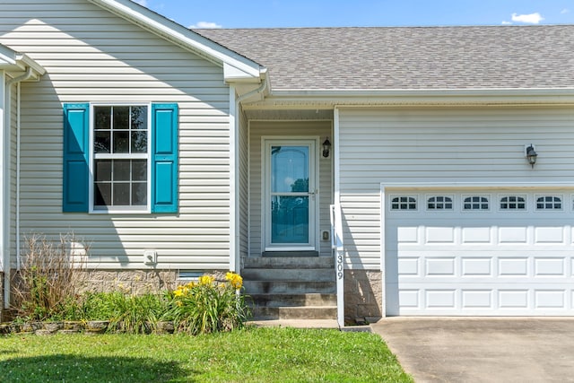 doorway to property featuring a garage