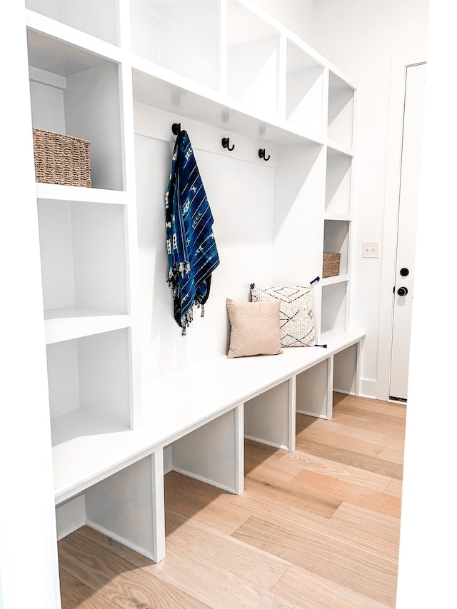 mudroom with light hardwood / wood-style flooring