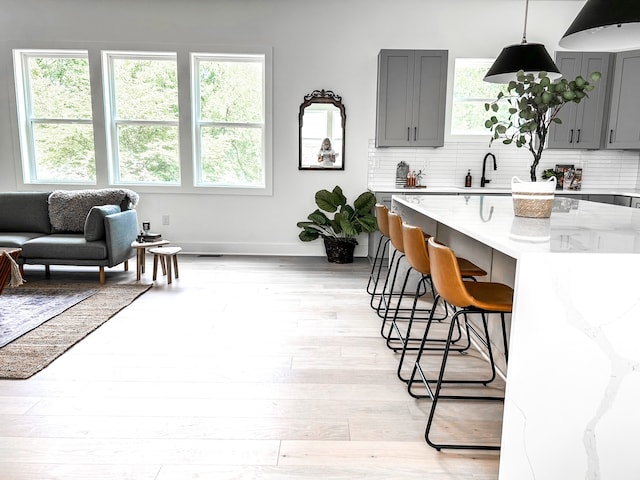 interior space with sink and light hardwood / wood-style floors