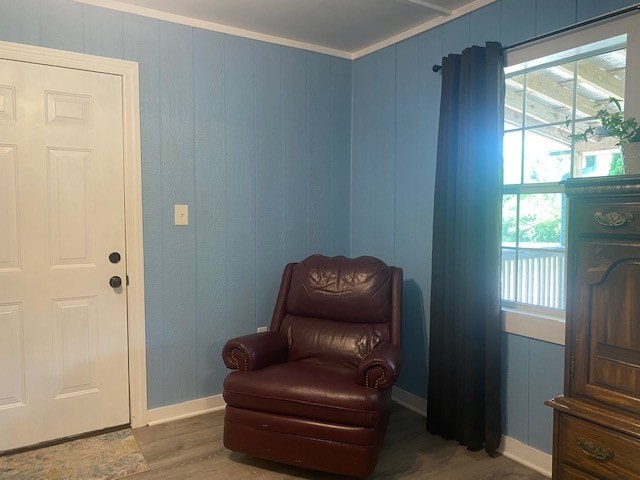 sitting room featuring dark hardwood / wood-style flooring and ornamental molding