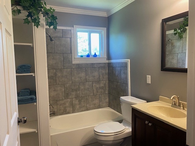 full bathroom featuring ornamental molding, toilet, oversized vanity, and tiled shower / bath